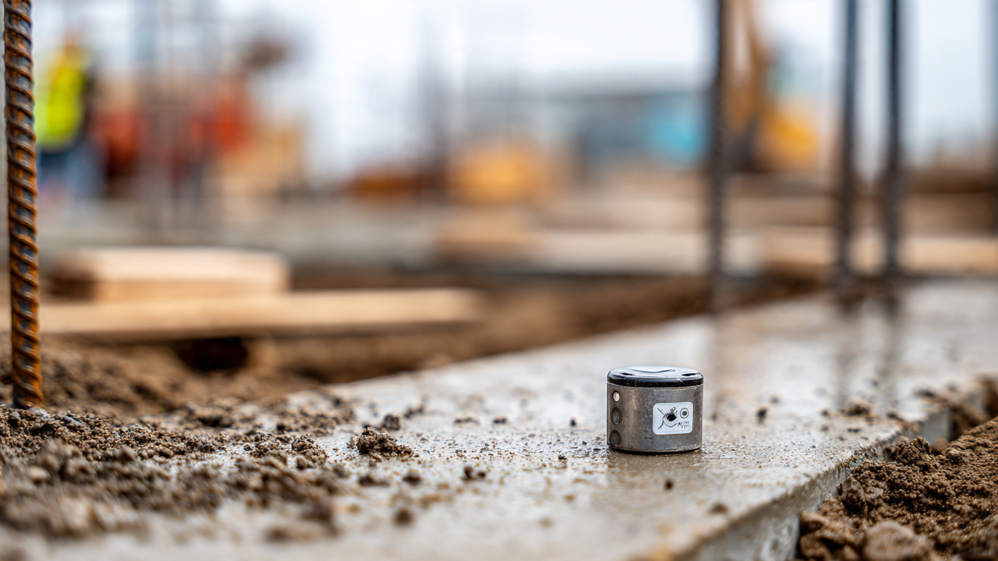 Wireless concrete maturity sensor attached to rebar in a residential foundation form before a pour